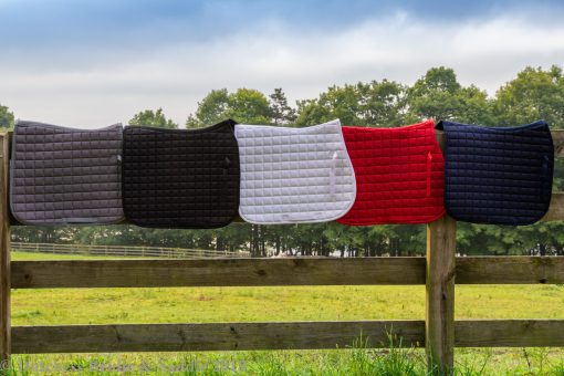 Horze Bristol AP saddle pads in gray, black, white, red, and peacock navy blue