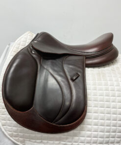 A Devoucoux Biarritz O Jump Saddle 2176 on top of a white blanket.