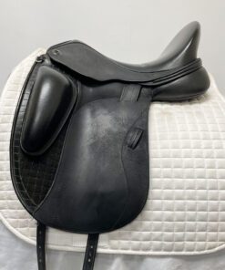 Black dressage saddle on a white background