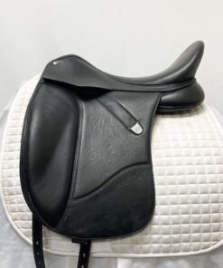 Black leather dressage saddle on a white background