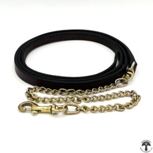 A black leather dog leash with gold chain.