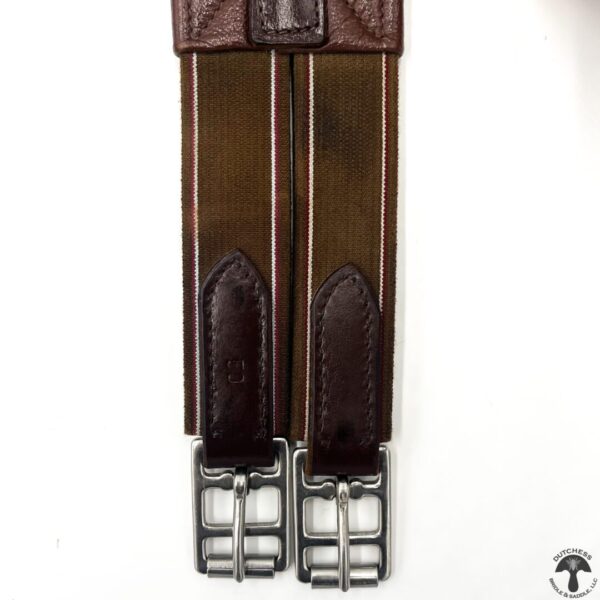 A pair of brown leather suspenders with metal buckles.