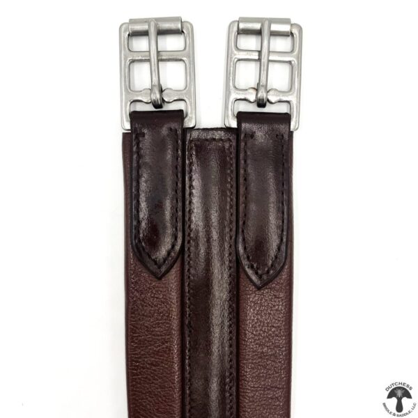 A pair of brown leather stirrups with silver buckles.