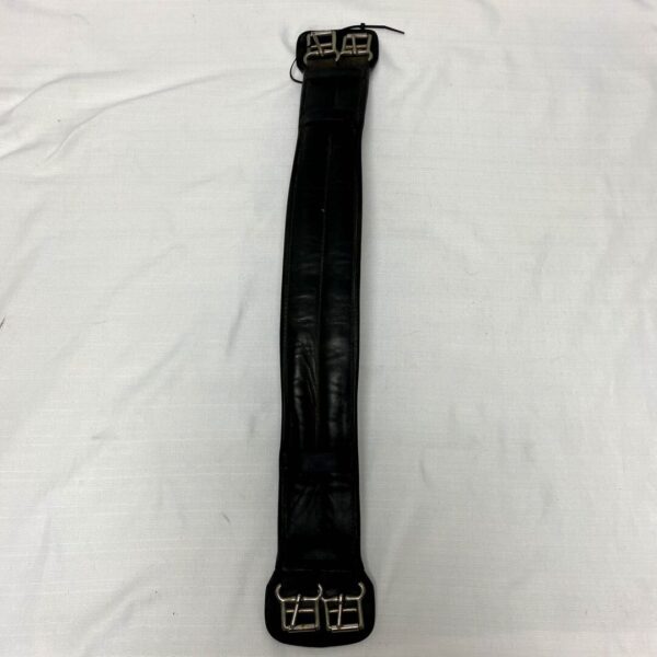 A black leather strap with white lettering on it.