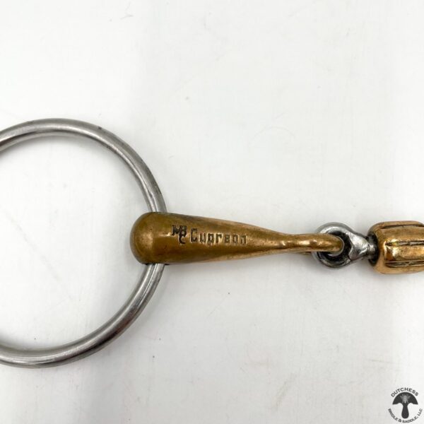 A key chain with a metal handle and a small bell.