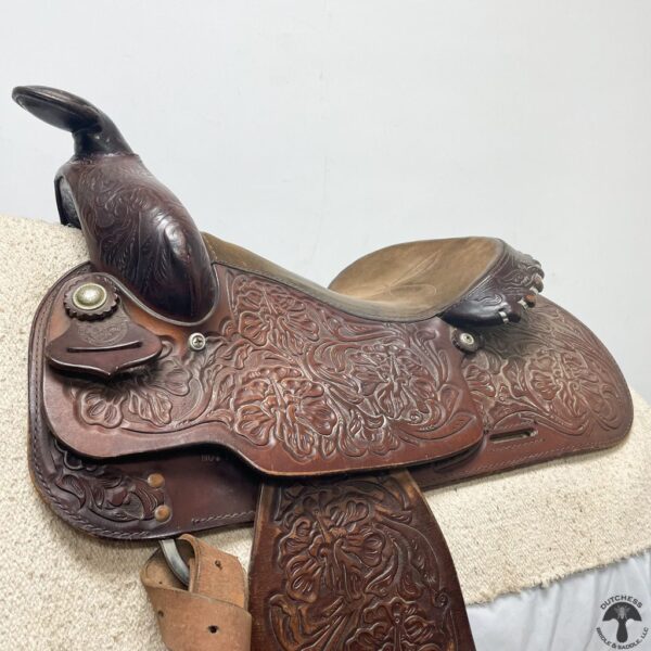 A close up of the saddle on a horse