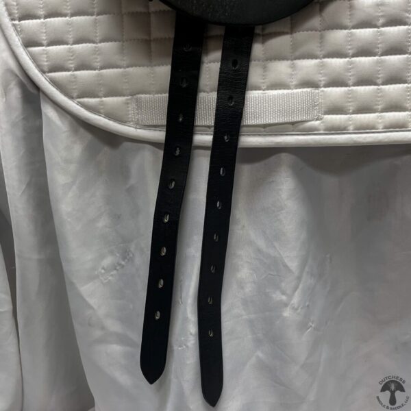 A close up of the straps on a white jacket