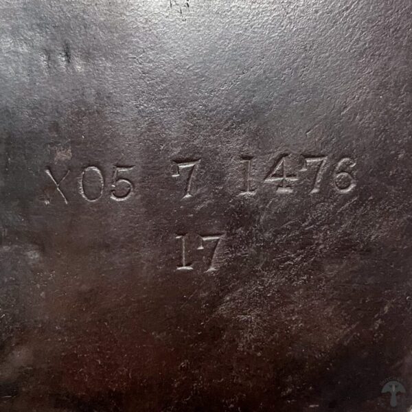 A close up of the number 1 7 on a leather surface