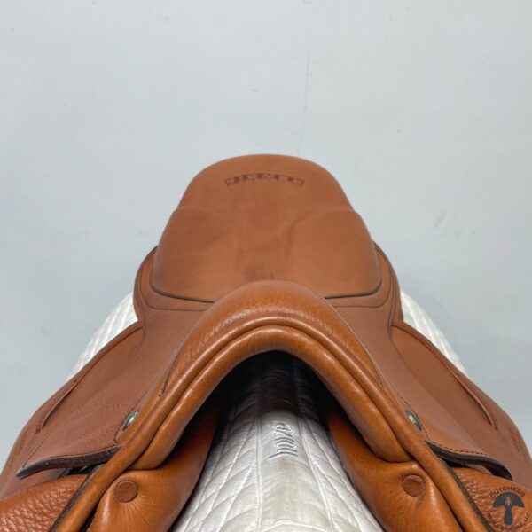 A close up of the saddle on a horse