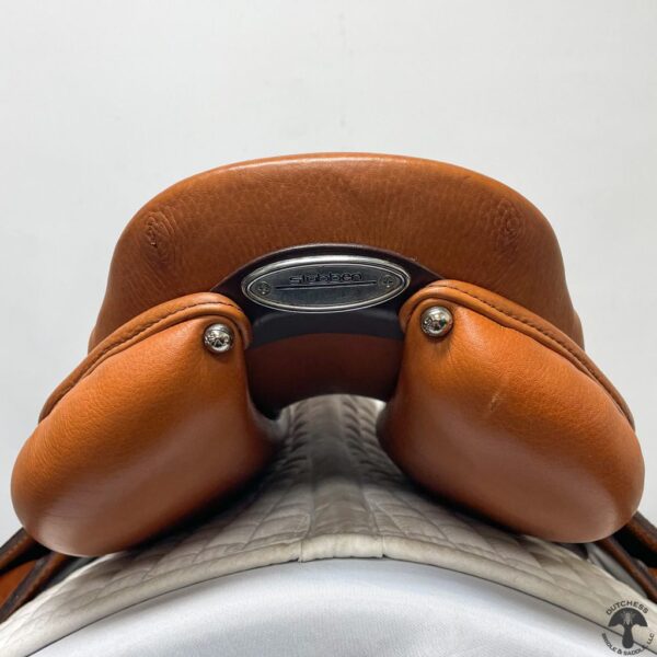 A close up of the back end of a saddle.