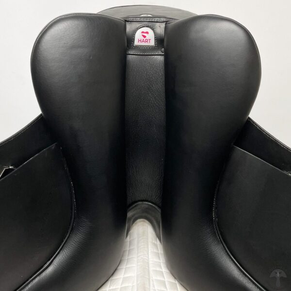 A close up of the back rest on a black saddle