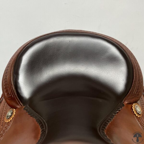 A close up of the back end of a saddle.