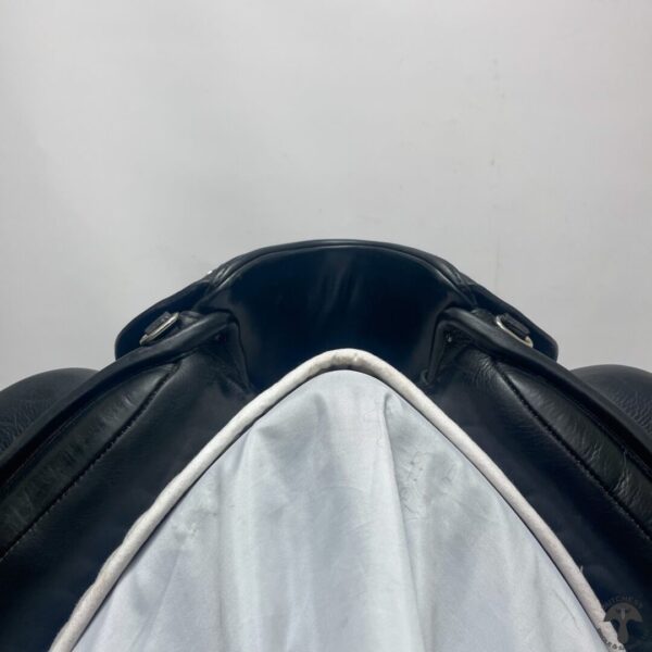 A black and white picture of the top of a backpack.