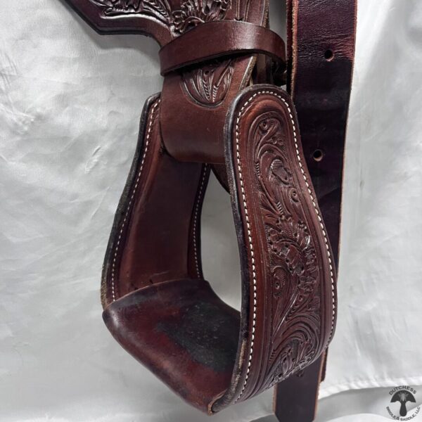 A close up of the side of a cowboy gun holster