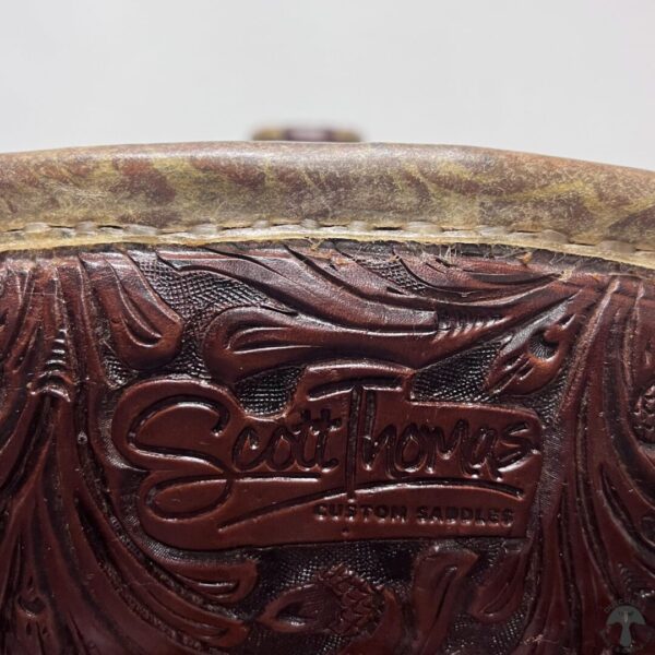 A close up of the lettering on a brown leather bag