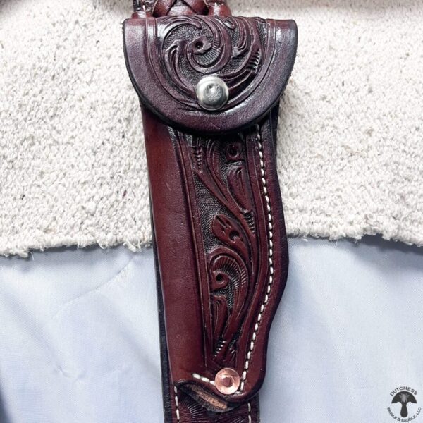 A close up of the leather on a knife sheath