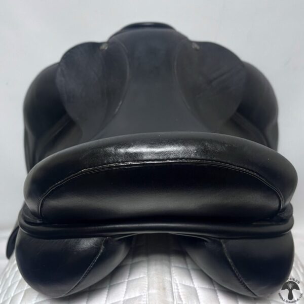 A close up of the seat on a black saddle