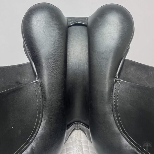 A close up of the back end of a horse saddle.