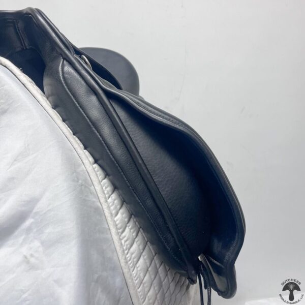 A close up of the top part of a black saddle bag.