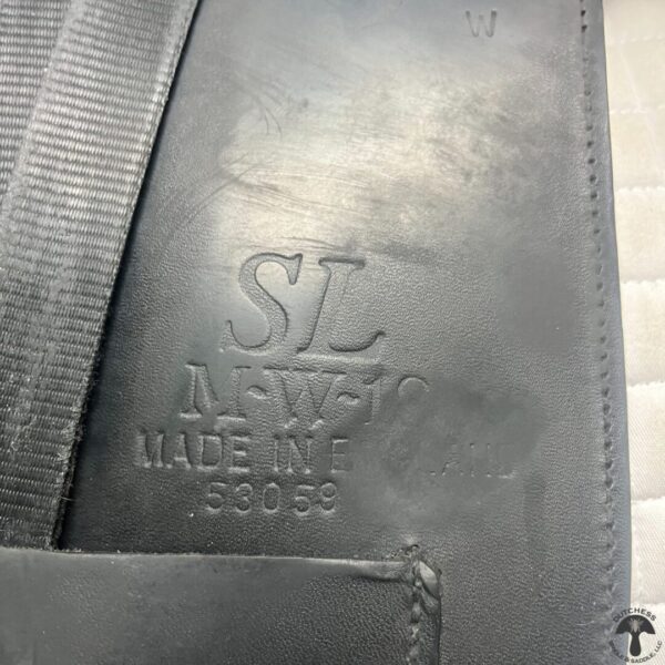 A close up of the letters on a leather bag