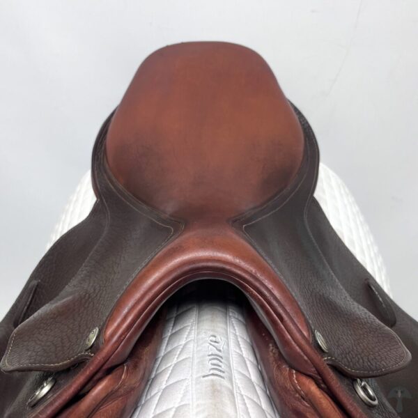 A close up of the saddle on a horse