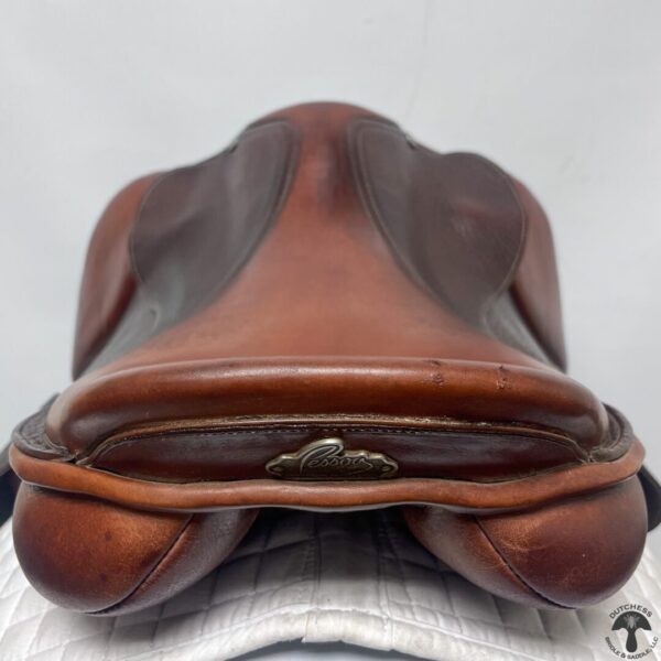 A close up of the saddle on a horse