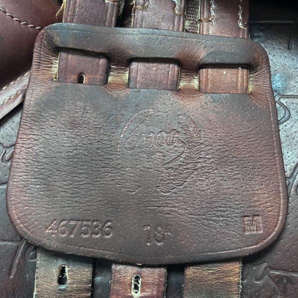 A close up of the leather pocket on a bag