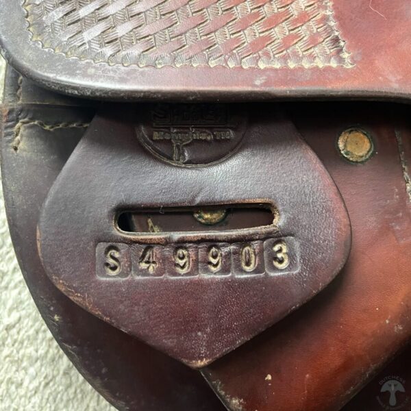 A close up of the number plate on a saddle