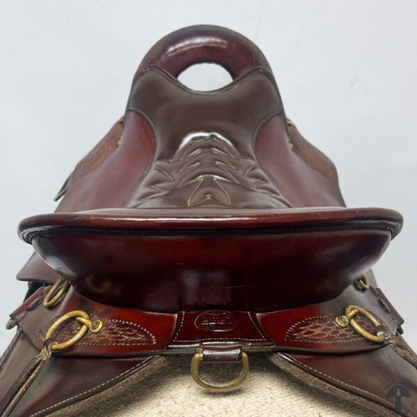 A close up of the saddle on a horse