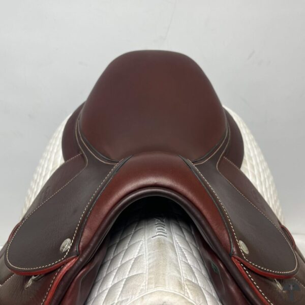 A close up of the saddle on a horse