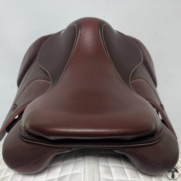 A close up of the seat on a brown saddle