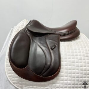 A close up of the saddle on a horse.