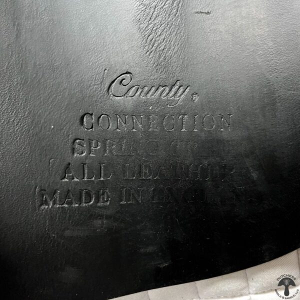 A close up of the words county written on top of an iron pan.