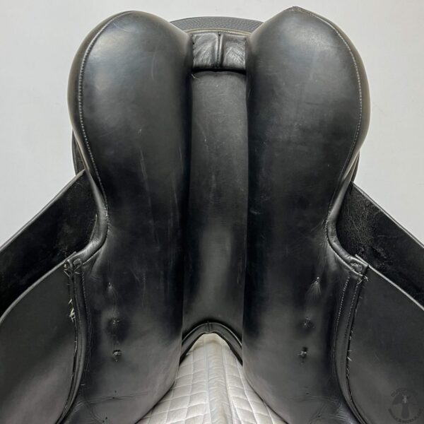 A close up of the back end of a horse saddle.