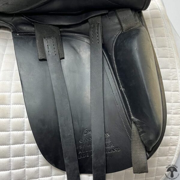 A close up of the back end of a horse saddle.