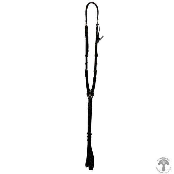 A black whip is hanging on the wall.