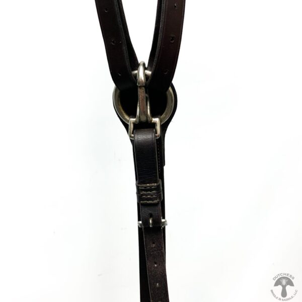 A close up of the strap on a horse