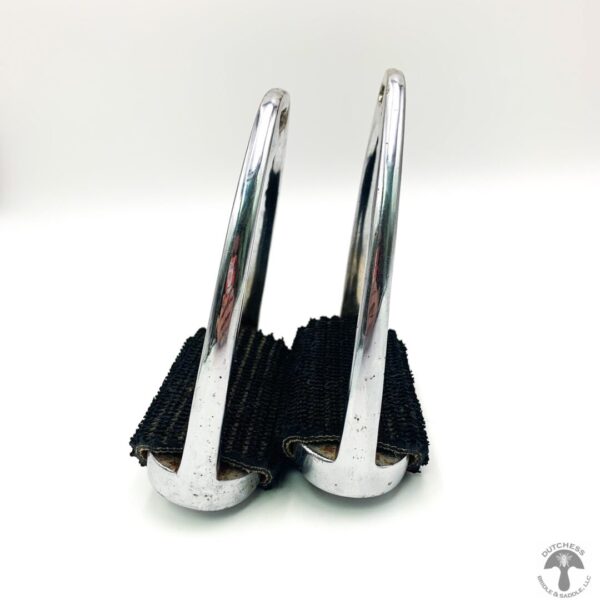 A pair of metal handles with black brushes on them.