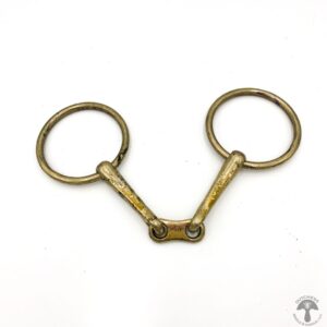 A pair of brass horse bit with two rings.