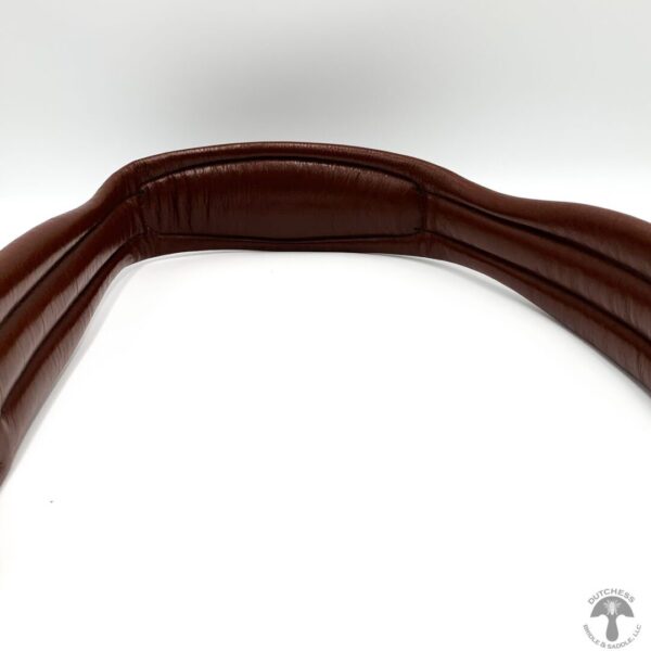 A brown leather belt with three rows of straps.