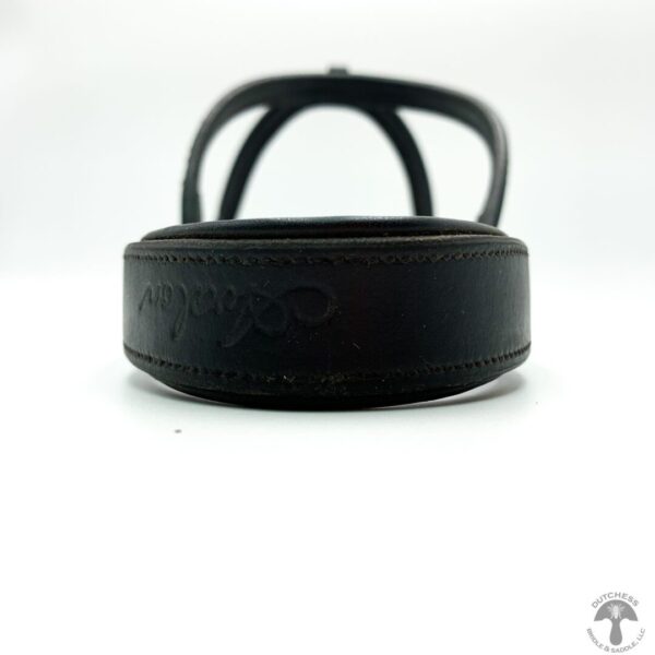 A close up of the side of a black strap