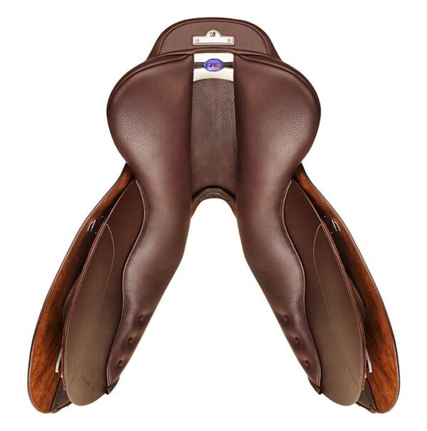 A saddle that is sitting on the ground.