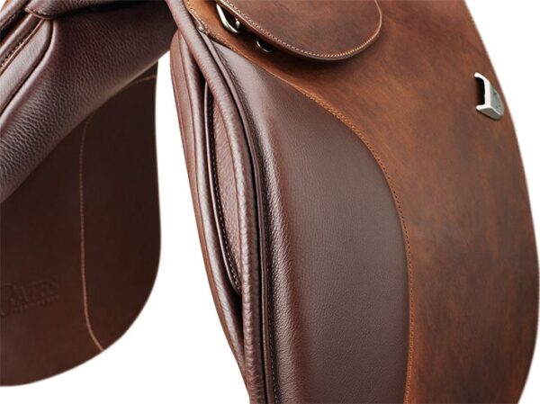 A close up of the saddle on a horse