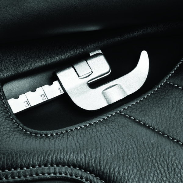 A close up of the seat belt buckle on a car