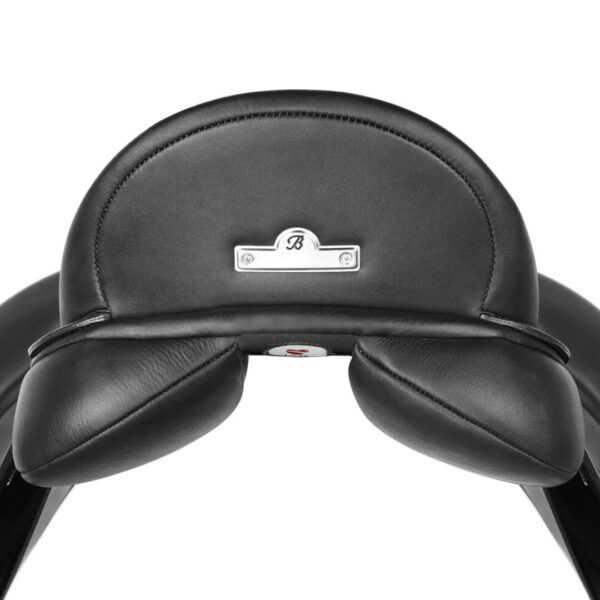 A close up of the head rest on a black leather chair