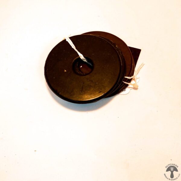 A brown disc with a white string on top of it.