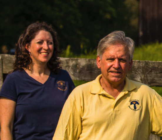 A man and woman standing next to each other.