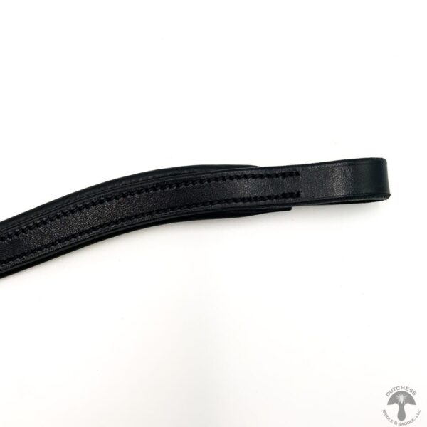 A close up of the side of a black leather belt