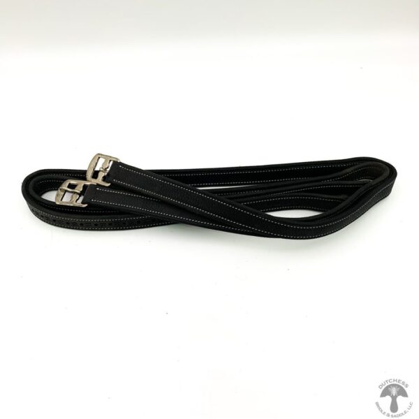 A black leash with silver hardware on top of a white table.