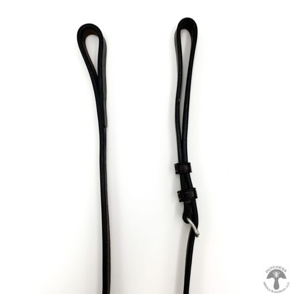 A pair of black leather dog leashes on a white background.